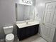 Bathroom featuring toilet, vanity with sink, and framed mirror at 3015 Winston Dr # 111, Burlington, NC 27215