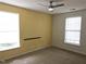 Bedroom with carpet, ceiling fan, natural lighting, and neutral color scheme at 3015 Winston Dr # 111, Burlington, NC 27215