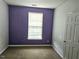 Cozy bedroom features a window providing natural light and carpet flooring at 3015 Winston Dr # 111, Burlington, NC 27215
