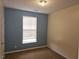 Bedroom features neutral walls, window with blinds, and carpet flooring at 3015 Winston Dr # 111, Burlington, NC 27215