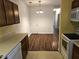 Dining area with adjacent door, hardwood floors, and a kitchen view at 3015 Winston Dr # 111, Burlington, NC 27215