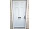 White front door with the number 111 in black numbers centered on the door at 3015 Winston Dr # 111, Burlington, NC 27215