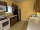 Functional kitchen with wooden cabinets and essential appliances at 3015 Winston Dr # 111, Burlington, NC 27215