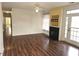 Inviting living room with hardwood floors, fireplace, ceiling fan, and natural light at 3015 Winston Dr # 111, Burlington, NC 27215