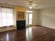 Spacious living room with hardwood floors, a ceiling fan, and a fireplace at 3015 Winston Dr # 111, Burlington, NC 27215