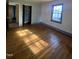 Comfortable bedroom featuring hardwood floors, neutral walls, and ample natural light at 327 Holland Dr Rd, Smithfield, NC 27577