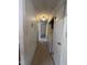 Bright hallway with multiple doors and access to the laundry area at 327 Holland Dr Rd, Smithfield, NC 27577