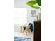 Comfortable reading nook near the window features a rattan chair and leafy decor at 3303 Silver Star Dr, Durham, NC 27713