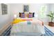 Inviting bedroom features comfortable bedding, stylish decor, and plenty of natural light at 3303 Silver Star Dr, Durham, NC 27713