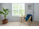 Cozy corner with a small table, rattan chair, and views of the outside at 3303 Silver Star Dr, Durham, NC 27713