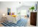 Bright bedroom with vaulted ceilings, large windows, and comfortable furnishings at 3303 Silver Star Dr, Durham, NC 27713