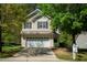 Inviting two-story home featuring a two-car garage and a well-maintained landscaped front yard at 3303 Silver Star Dr, Durham, NC 27713