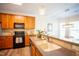 Well-equipped kitchen featuring granite countertops, wood cabinets and stainless steel appliances at 3303 Silver Star Dr, Durham, NC 27713
