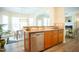 Bright eat-in kitchen features stainless steel appliances, wood cabinets, and lots of natural light at 3303 Silver Star Dr, Durham, NC 27713