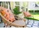 Charming patio seating area with comfortable wicker chairs and vibrant accent pillows, offering a cozy retreat at 3303 Silver Star Dr, Durham, NC 27713