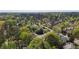 A neighborhood aerial showcasing houses surrounded by lush green trees and landscaping at 3308 Churchill Rd, Raleigh, NC 27607
