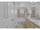Bright bathroom features colorful tiled walls, granite countertop vanity, and plenty of storage at 3308 Churchill Rd, Raleigh, NC 27607