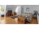 Bright bedroom showing hardwood floors, a quilt covered bed, and a storage chest at 3308 Churchill Rd, Raleigh, NC 27607