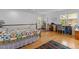 Spacious bedroom features hardwood floors, desk area, and natural light from multiple windows at 3308 Churchill Rd, Raleigh, NC 27607