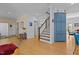 Spacious foyer featuring hardwood floors, staircase, and custom millwork at 3308 Churchill Rd, Raleigh, NC 27607