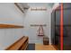 Organized mudroom with bench seating, coat hooks, and storage lockers at 3308 Churchill Rd, Raleigh, NC 27607