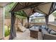 Relaxing back deck features a covered pergola with comfortable seating at 34 Stuart Dr, Benson, NC 27504