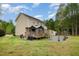Spacious backyard with deck, patio, and a well-maintained lawn at 34 Stuart Dr, Benson, NC 27504