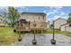 Outdoor patio and raised wood deck perfect for entertaining and relaxation at 34 Stuart Dr, Benson, NC 27504