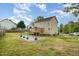 Well-kept home with back deck, patio, and lush green lawn at 34 Stuart Dr, Benson, NC 27504