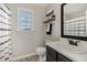 Well-lit bathroom features a sink with mirror and modern fixtures, offering a clean and functional space at 34 Stuart Dr, Benson, NC 27504