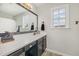 Well-maintained bathroom with a sleek vanity and mirror, providing a comfortable space at 34 Stuart Dr, Benson, NC 27504