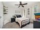 Cozy bedroom features carpet, ceiling fan, and a calming decor, creating a comfortable and inviting space at 34 Stuart Dr, Benson, NC 27504