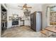 Modern kitchen featuring stainless steel appliances, white cabinetry, and stylish tile flooring at 34 Stuart Dr, Benson, NC 27504