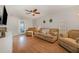 Spacious living room with hardwood floors and door to outdoor at 34 Stuart Dr, Benson, NC 27504