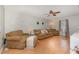 Bright living room with hardwood floors, neutral decor, and a ceiling fan at 34 Stuart Dr, Benson, NC 27504