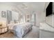 Spacious main bedroom with ceiling fan, vaulted ceilings, carpet floors and modern accents offers a comfortable retreat at 34 Stuart Dr, Benson, NC 27504