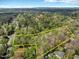 Aerial view of acreage in a rural setting, boundaries marked in yellow at 3508 Cole Mill Rd, Durham, NC 27712