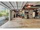 Unfinished basement with concrete floor, cinder block walls and overhead lighting at 3508 Cole Mill Rd, Durham, NC 27712