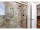 This bathroom has a tiled walk-in shower, bench, and support bars at 3508 Cole Mill Rd, Durham, NC 27712