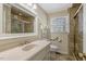 Bright bathroom with a white vanity, tile floor and a shower with glass door at 3508 Cole Mill Rd, Durham, NC 27712