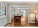 Cozy dining room with natural light, wood floors, and a view to the front porch at 3508 Cole Mill Rd, Durham, NC 27712