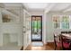 Inviting entryway with hardwood floors, and a view of the wooded outdoors at 3508 Cole Mill Rd, Durham, NC 27712