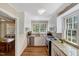 This kitchen has stainless steel appliances, granite countertops, and white cabinets at 3508 Cole Mill Rd, Durham, NC 27712
