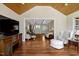 Open living area with hardwood floors, comfortable seating, and natural light at 3508 Cole Mill Rd, Durham, NC 27712