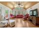 Bright living room featuring high ceilings, natural light, and comfortable seating at 3508 Cole Mill Rd, Durham, NC 27712