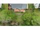 Aerial view of the home and backyard with mature trees and partial fencing at 3517 Boren Ct, Raleigh, NC 27616