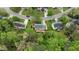 Home aerial view in a verdant cul-de-sac with mature trees at 3517 Boren Ct, Raleigh, NC 27616