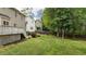 A spacious backyard with a wooden fence, deck, and ample greenery at 3517 Boren Ct, Raleigh, NC 27616