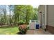 The back exterior shows a two-story siding with a deck overlooking a well-kept lawn and lush surroundings at 3517 Boren Ct, Raleigh, NC 27616