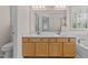 Bathroom featuring a double vanity with a large mirror and plenty of counter space at 3517 Boren Ct, Raleigh, NC 27616